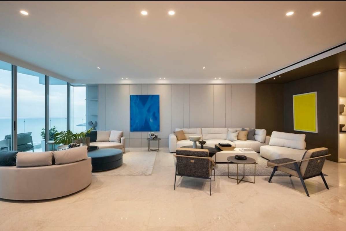 Modern living area with ocean views through floor-to-ceiling glass in Pacific Point Tower 400 Panama