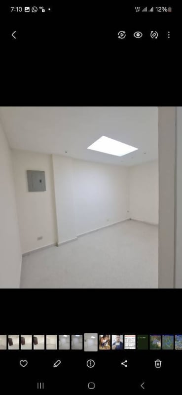 Empty interior commercial space with bright skylight white walls located at PH Torre Avenida Perú Panama City