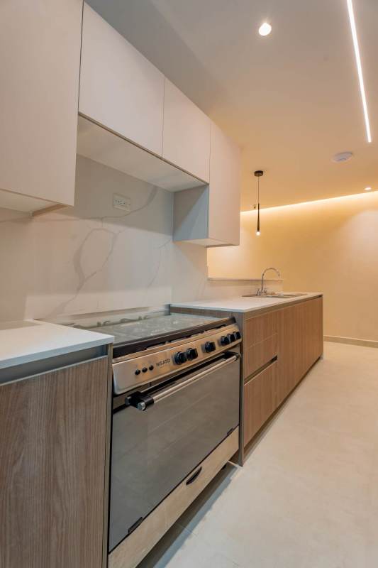 Open living and dining room leading to balcony in Condado Gardens Condado del Rey Panama