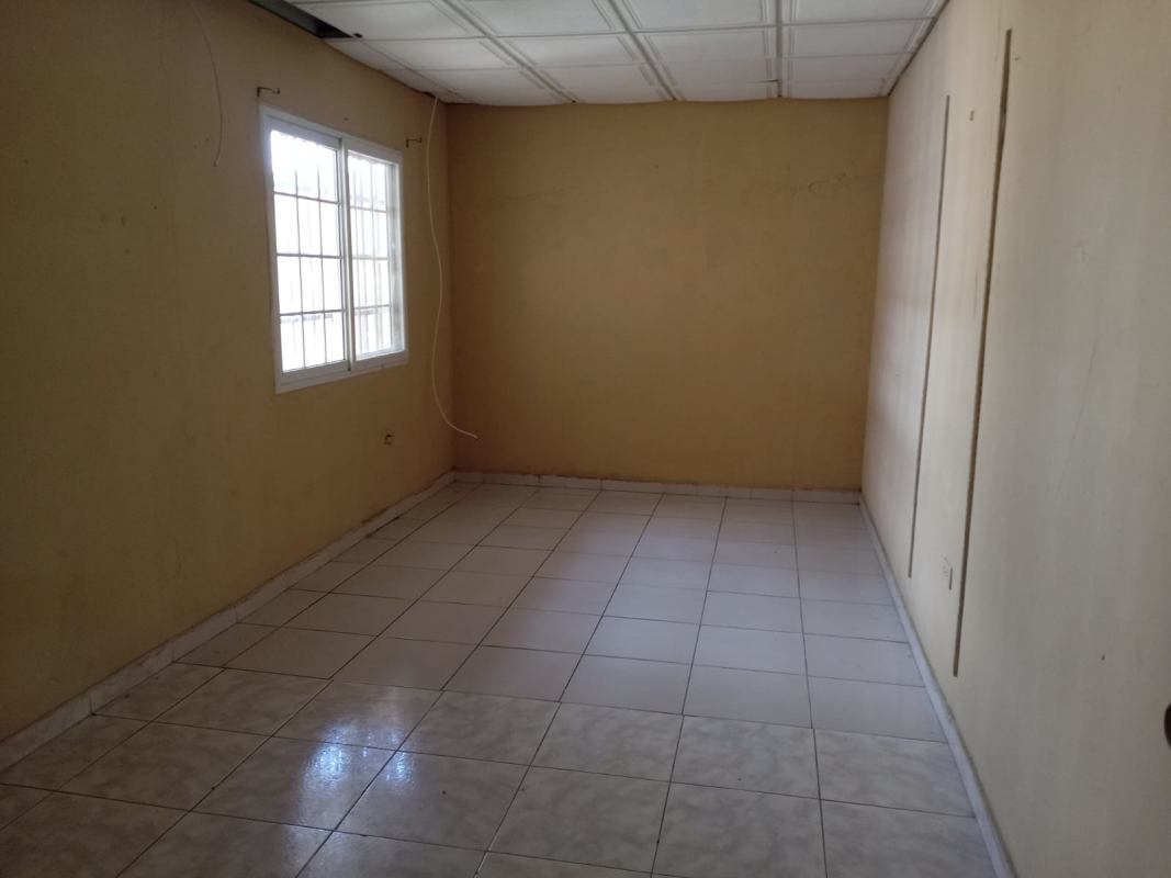 Unfinished interior room with tiled floors and drop ceiling in Don Bosco Panama