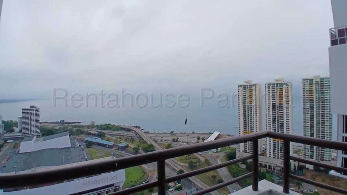 Rooftop infinity edge pool with lounge chairs overlooking ocean in PH Mandarin Bay Panama City