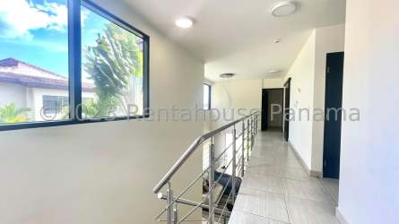 Open plan dining area with ceramic floors and garden views Panama Pacifico house