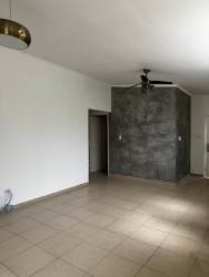Living room with tile floor, ceiling fan, accent wall in house for rent Brisas del Golf Panama