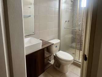 Empty living area with gray accent, tiled floors, ceiling fan in Panama Oeste house for rent