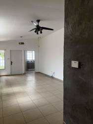 Spacious living area with tile flooring, white walls, ceiling fan in Brisas del Golf Arraiján Panama