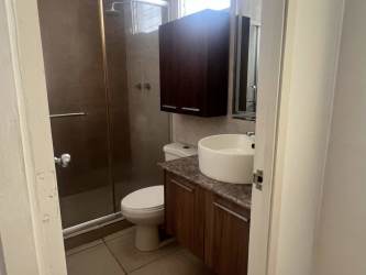 Modern bathroom with glass shower, vessel sink, marble countertop, tiled floors in Brisas del Golf Arraiján