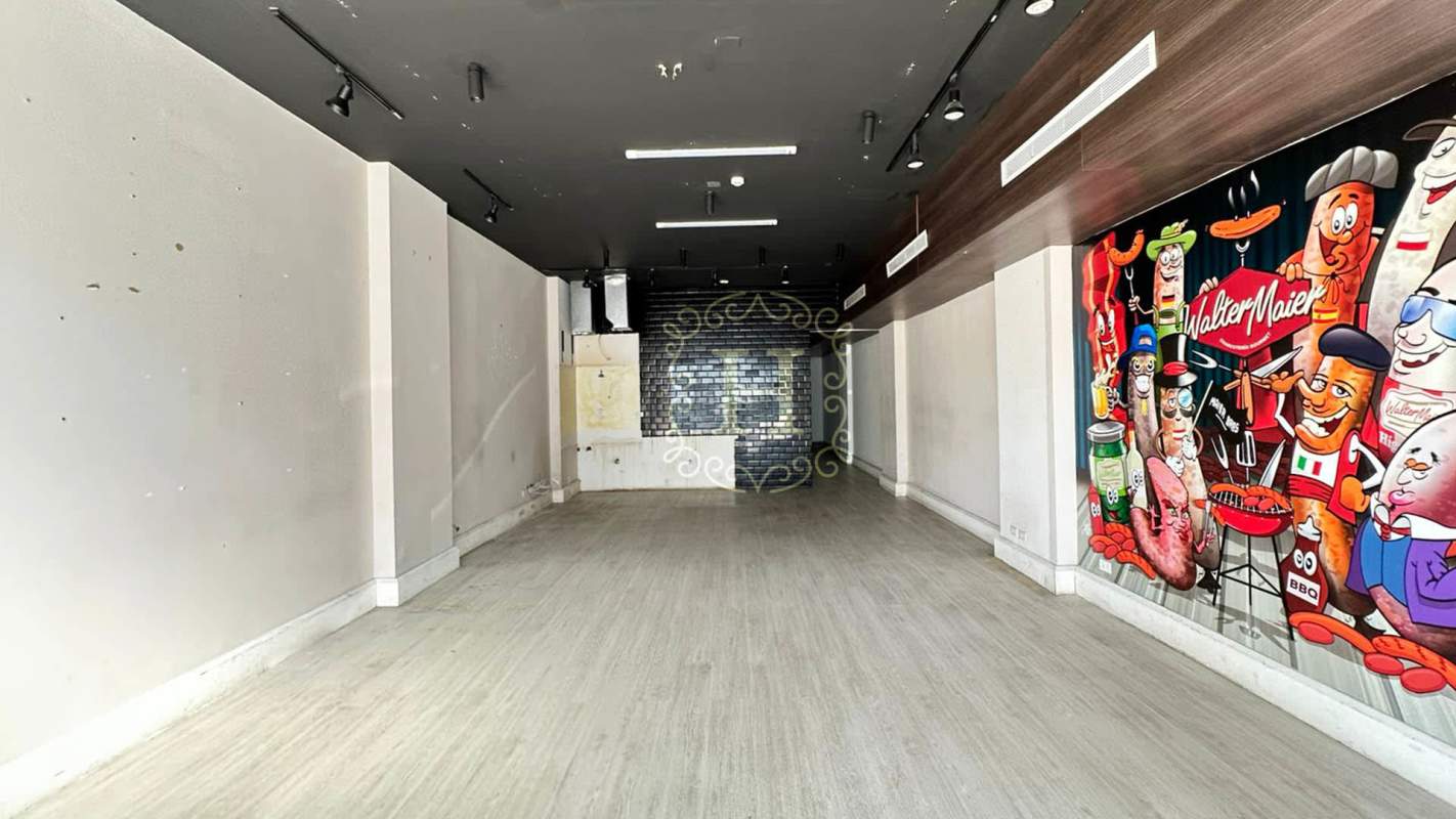 Commercial retail interior with pop art mural, brick backsplash and open floor design in San Francisco Plaza Panama