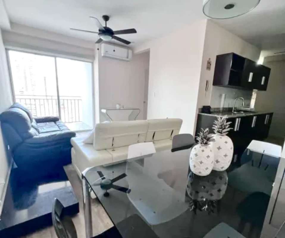 Glass dining table and stylish chairs in furnished apartment PH El Doral Panama City