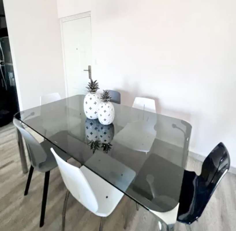 Equipped kitchen with granite counters, double refrigerator and stove at PH El Doral 12 de Octubre