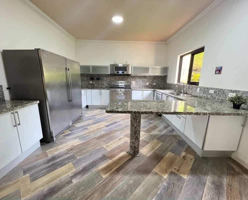 Renovated kitchen with stainless appliances granite counters modern finishes Embassy Club Clayton