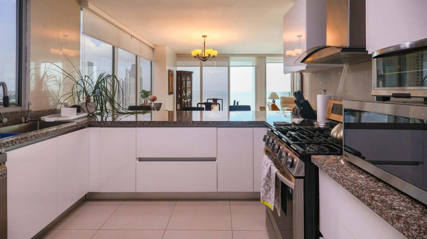 Contemporary bathroom with glass shower, granite vanity and tile walls at PH Prive Tower San Francisco Panama