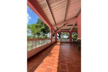 Expansive tropical garden grounds with mature trees and lake access in luxury estate Colon Panama