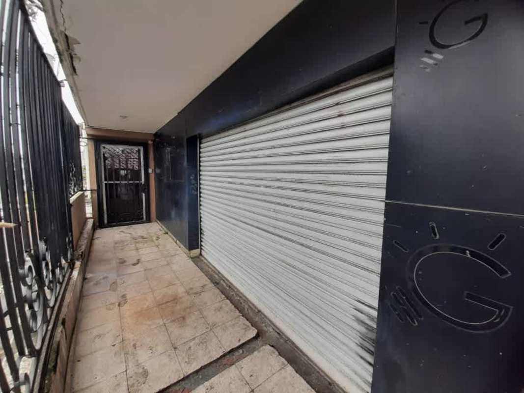 Covered entry area with security grilles and tile floor of commercial unit Parque Lefevre Panama