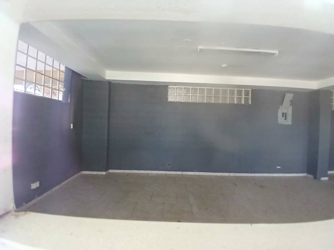 Interior space with glass block windows, tiled floor commercial plaza Parque Lefevre Panama