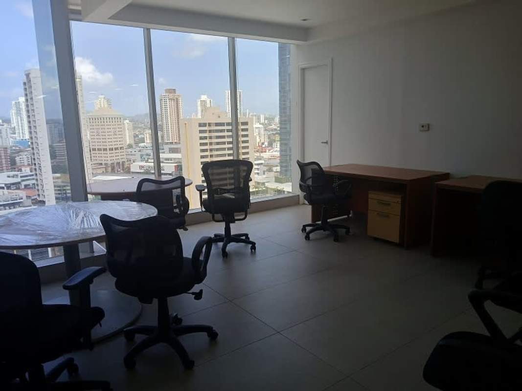Modern commercial office with floor to ceiling windows overlooking Panama City skyline in PH SL-55 Obarrio Panama