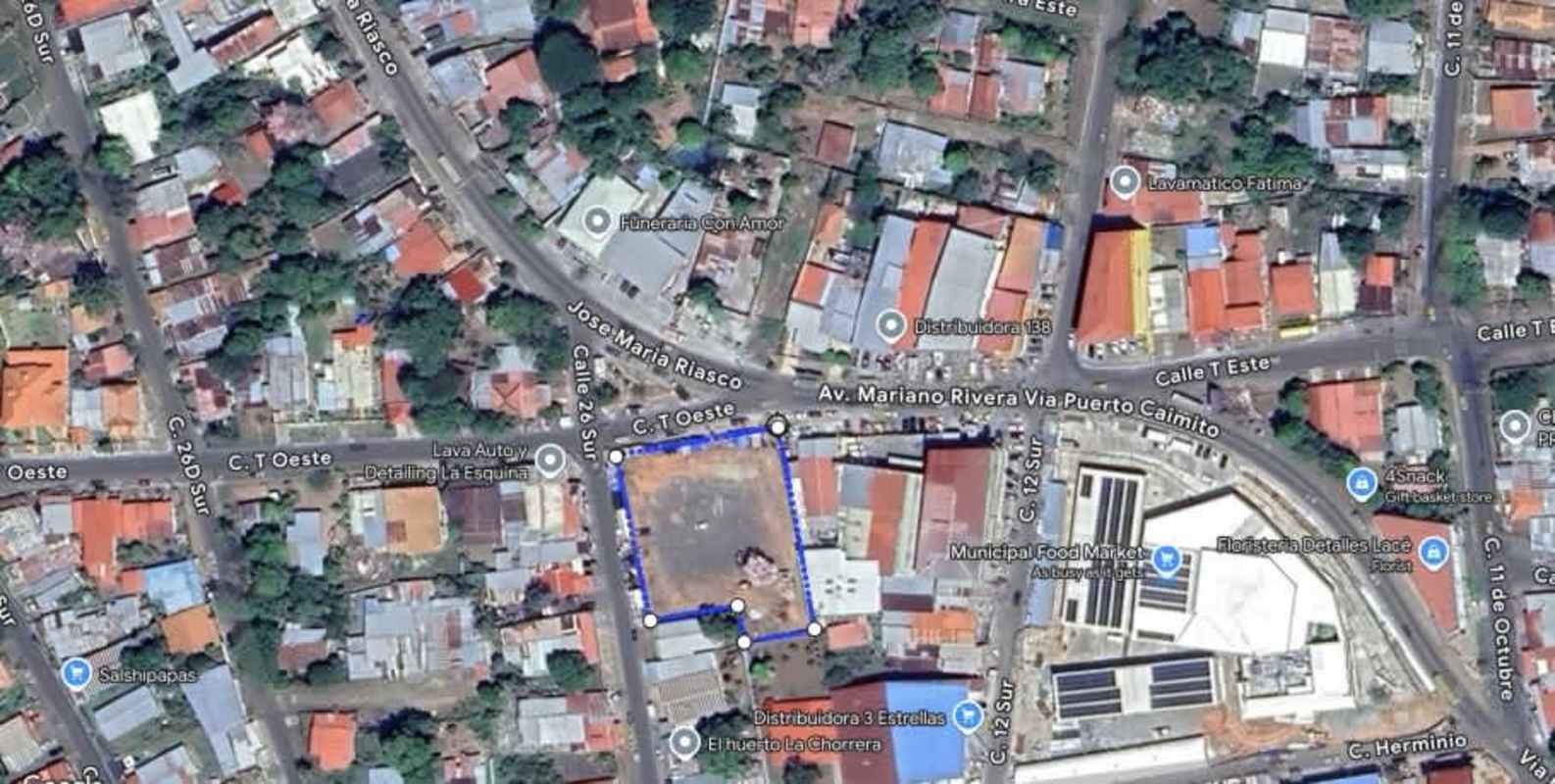 Aerial view of vacant commercial land central La Chorrera surrounded by businesses