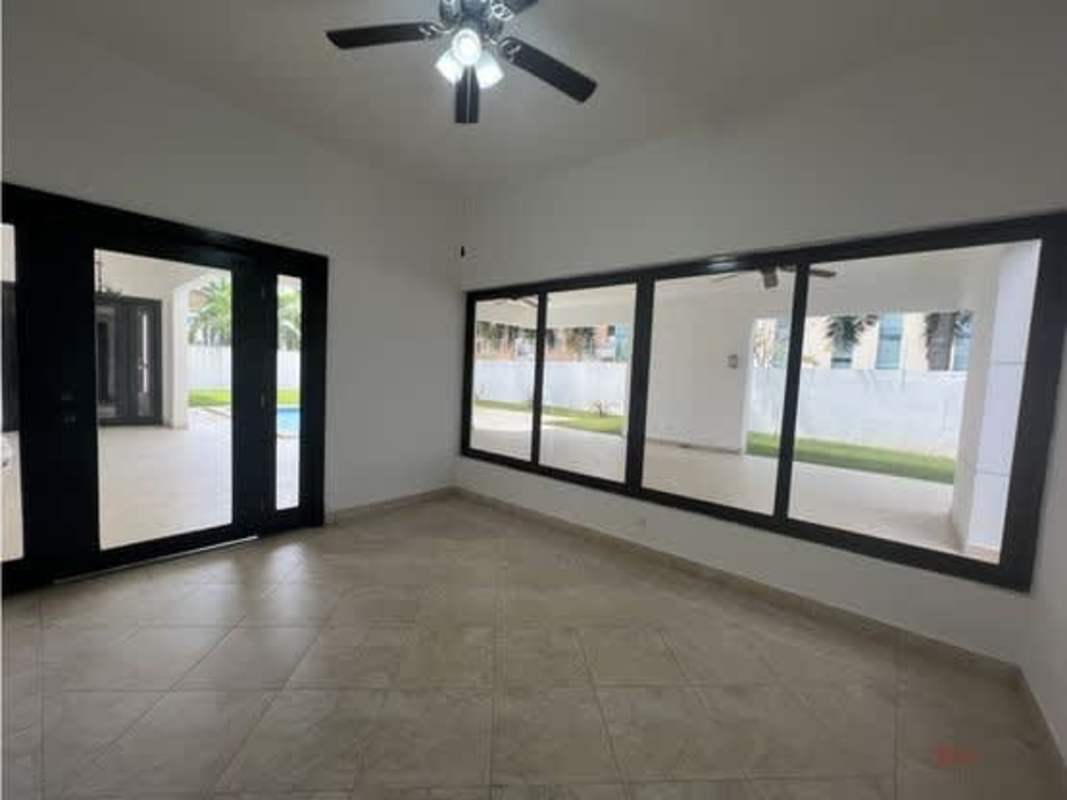 Spacious bedroom with large closet, ceiling fan, tile flooring in Panama luxury home