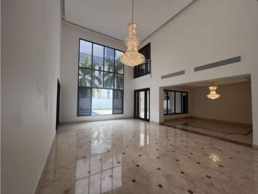 Spacious living room with marble floor and floor-to-ceiling windows in Costa del Este Panama