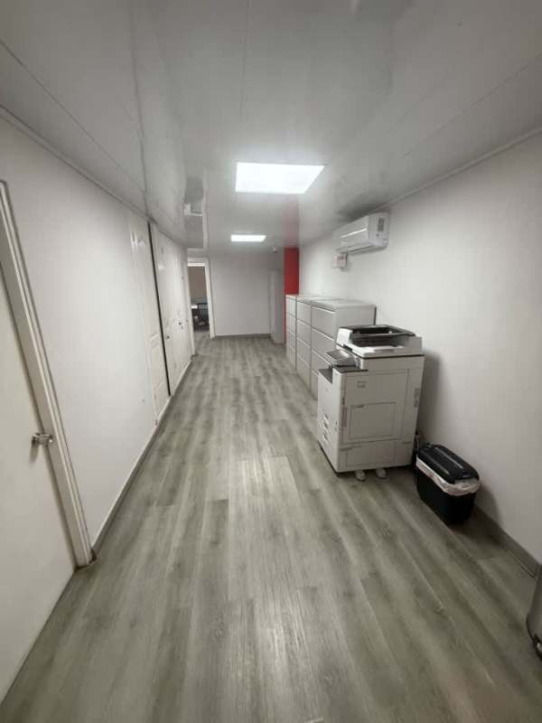 Open plan minimalist office space inside warehouse facility in Juan Díaz Panama City