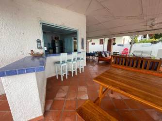 Bedroom with light blue walls, fan, closet space, terracotta floors Farallón Panama villa