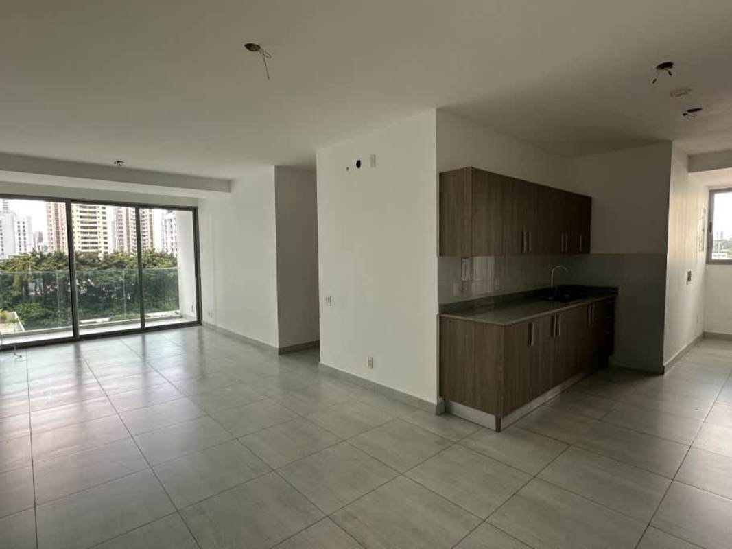 Open minimalist living space with tile flooring PH Astre Haus Panama