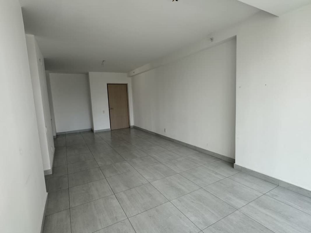 Living room with balcony access and natural light in PH Astre Haus Panama