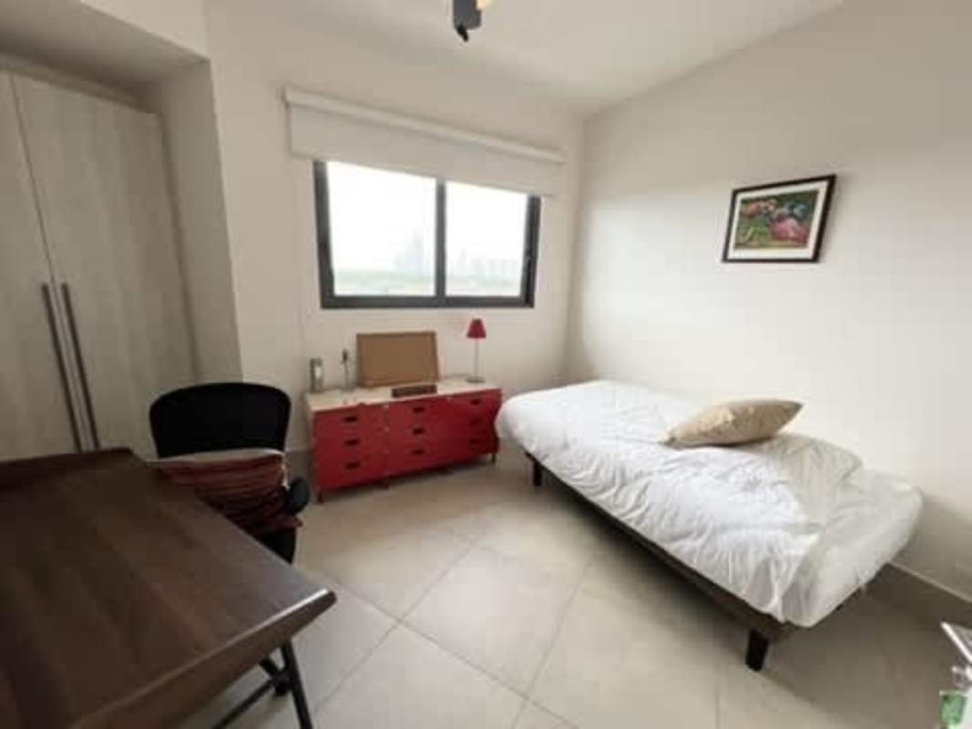 Modern bedroom with large windows, golf view, luxury furnishings