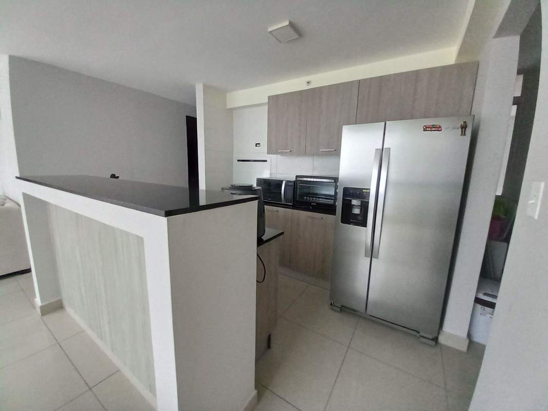 Contemporary kitchen with breakfast bar, stainless steel appliances PH Coral Tower Carrasquilla Panama City