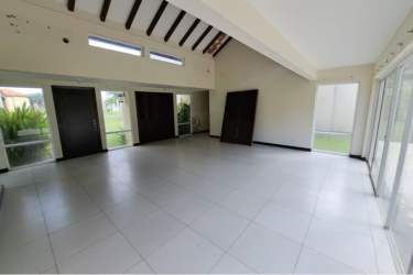 Kitchen featuring granite counters, vaulted ceiling, and natural light in Villas Decameron Rio Hato Panama