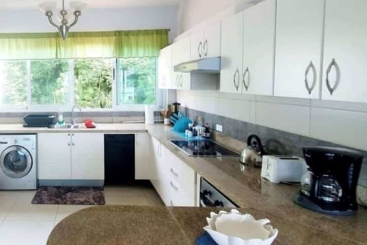 Open dining space with sea view balcony at PH Brisas Amador Isla Perico Panama City