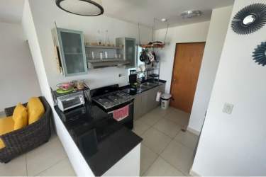Open kitchen in Playa Blanca apartment with granite counters, appliances, Coclé Panama