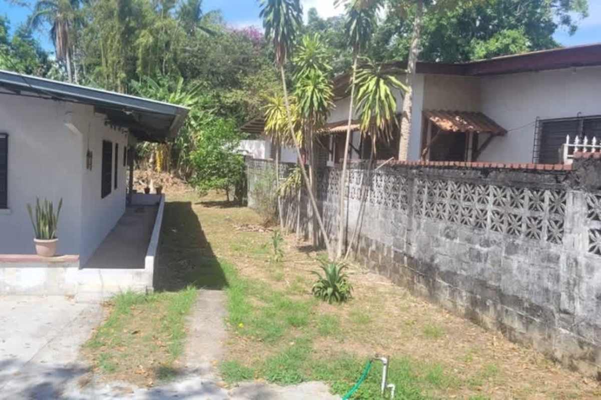 Empty bedroom with tiled floors white walls and window Ciudad Radial Panama house for sale