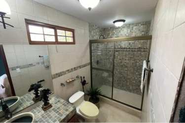 Classic kitchen with wood cabinets, tile backsplash, modern appliances Panama luxury estate