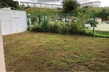 Simple bedroom with tiled floor and barred window Brisas del Golf Arraiján Panama