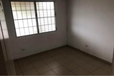 Front facade and driveway of single-story house in Brisas del Golf Arraiján Panama