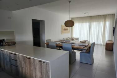 Open kitchen with quartz countertops appliances PH Solaria Punta Caelo Panama