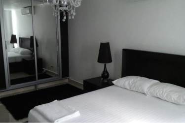 Aerial image of beachfront condo complex PH Playa Corona Suites with beach, ocean, and landscaping in San Carlos Panama