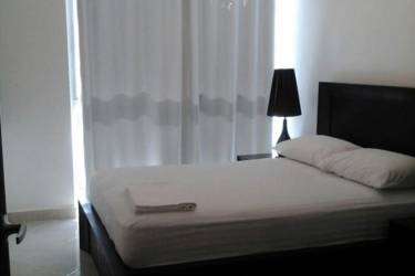 Modern beachfront high-rise building with landscaped gardens and direct beach access in Playa Corona Panama