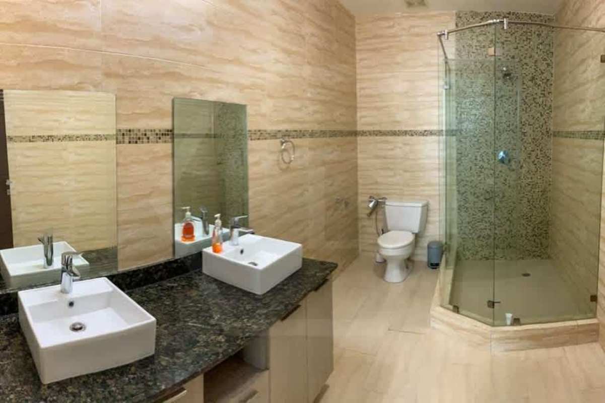 Modern bathroom with bathtub, granite vanity and elegant fixtures Grand Tower Panama
