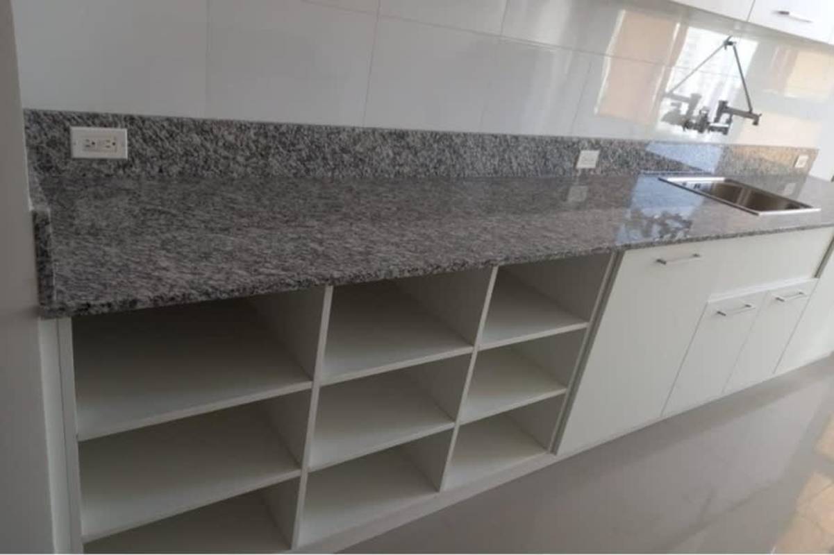 Luxury kitchen with island, granite countertops, panoramic window in oceanfront penthouse PH Marea Costa del Este Panama
