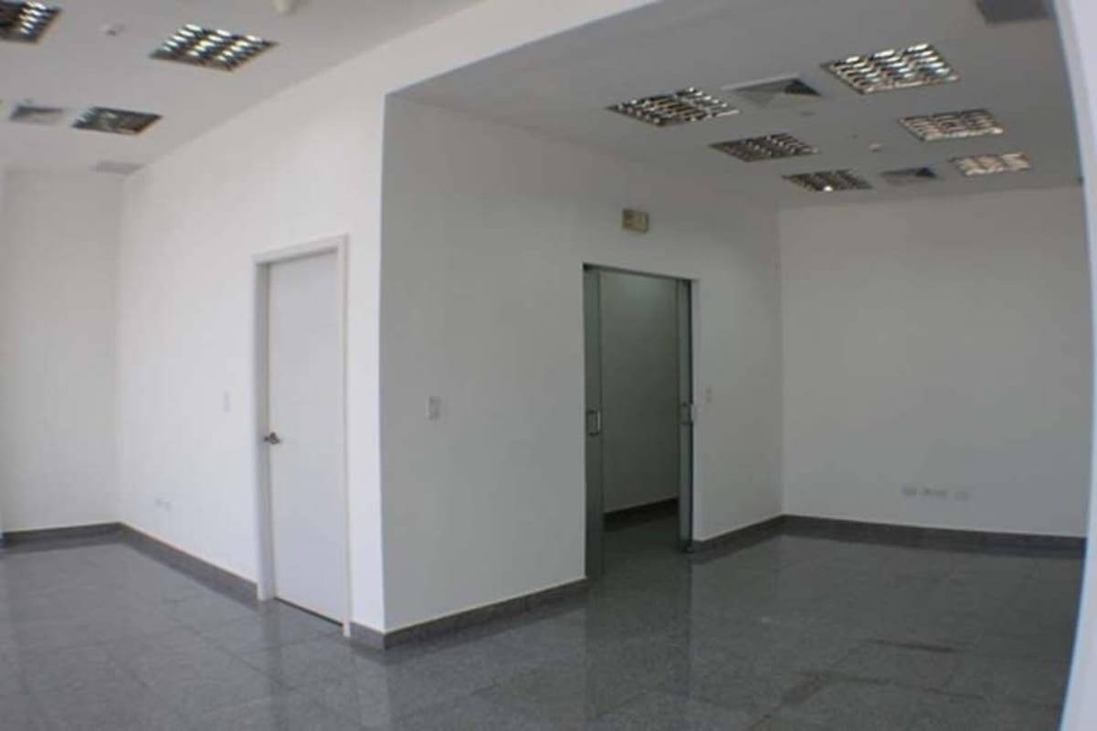 Spacious unfurnished office interior with tiled floors, drop ceiling, in BICSA Tower Panama City