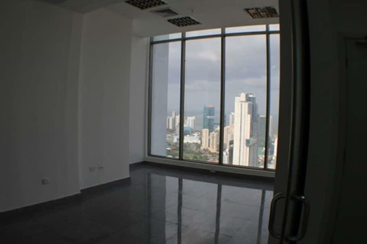 Empty office with panoramic city and ocean views floor-to-ceiling windows at BICSA Tower Panama City