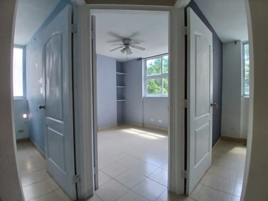 Colorful kids bedroom with vehicle mural and large window at Edison Park Tower Panama