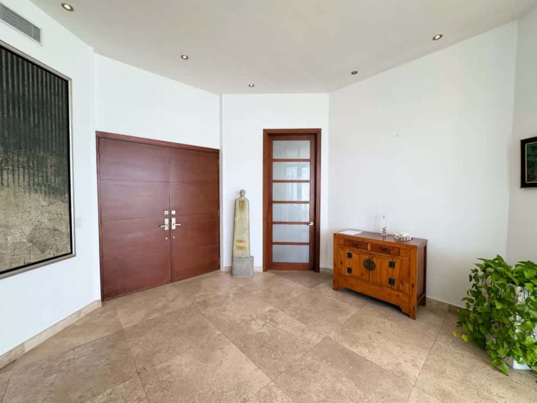 Luxury master bedroom panoramic ocean views floor to ceiling windows in Bahia Pacifica Panama