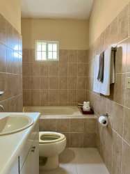 Modern tiled bathroom with shower in 3-bedroom house Chame Panama Oeste