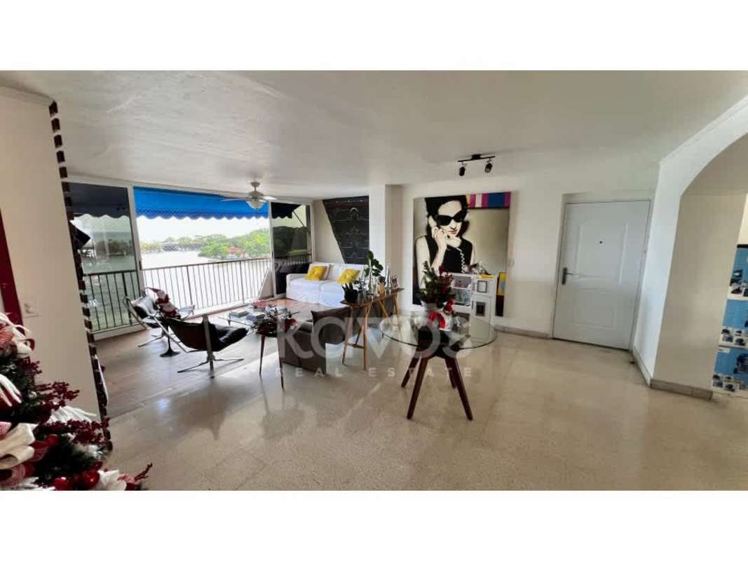 Kitchen with brick details, wood cabinetry and appliances in PH Las Llamas Coco del Mar oceanfront apartment