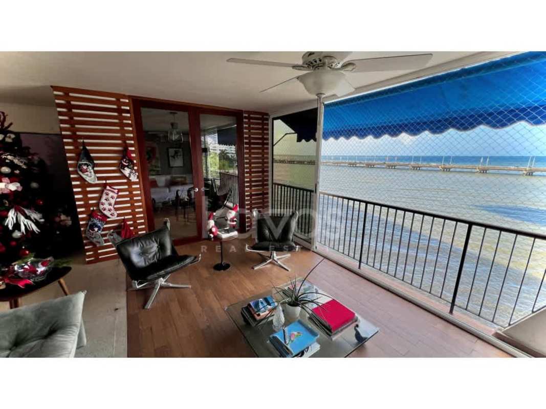 Bathroom with mosaic tile, vessel sink and wood counter in oceanfront apartment PH Las Llamas Coco del Mar