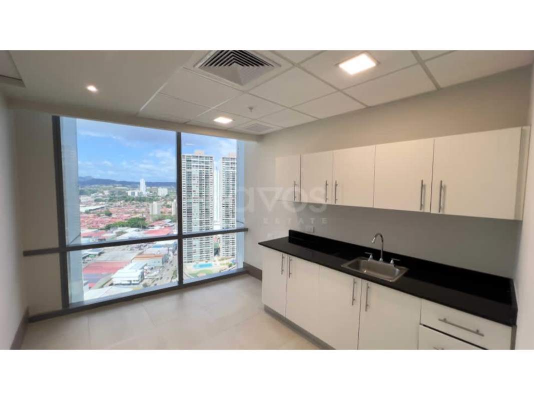 Spacious kitchenette with city view window, modern cabinetry and sink inside office for rent Financial Park Panama