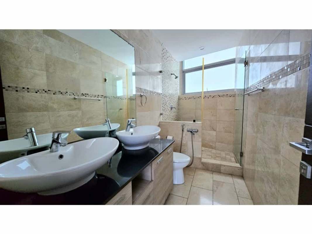 Elegant bathroom with double vessel sinks and mosaic accents in Grand Tower Punta Pacifica Panama