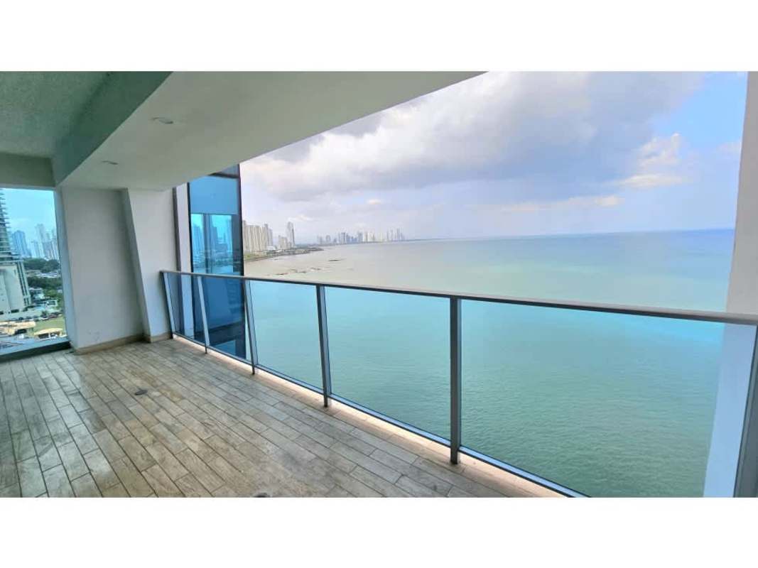 Spacious modern balcony with glass rails overlooking Pacific Ocean and Panama skyline in Grand Tower